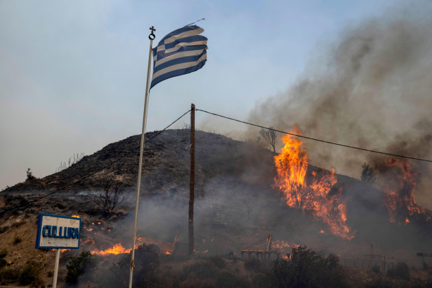 flames-burn-a-hill-on-the-aegean-sea-island-of-rhodes-southeastern-greece-on-monday-july-24-2023-a-weeklong-wildfire-on-the-greek-island-of-rhodes-has-torn-past-defenses-forcing-more-evacuations