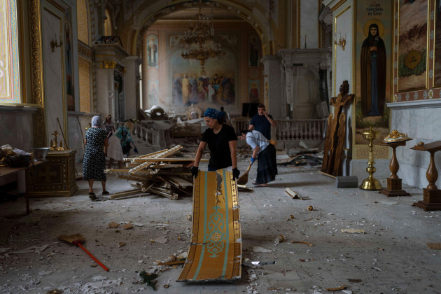 people-clean-up-inside-the-odesa-transfiguration-cathedral-after-it-was-heavily-damaged-in-russian-missile-attacks-in-odesa-ukraine-sunday-july-23-2023-ap-photojae-c-hong