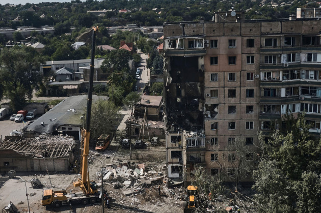emergency-services-work-at-a-scene-after-a-missile-hit-an-apartment-building-in-kryvyi-rih-ukraine-monday-july-31-2023-ap-photolibkos