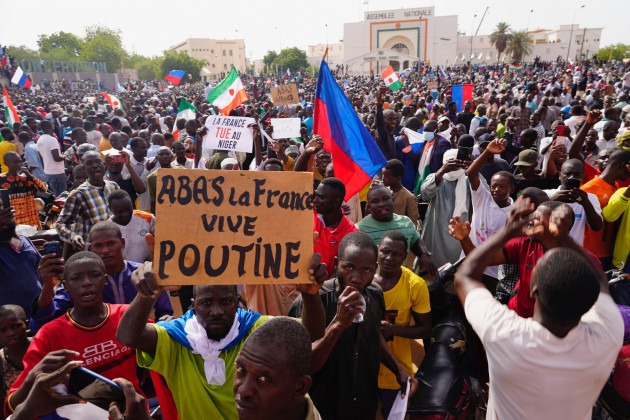 nigeriens-participate-in-a-march-called-by-supporters-of-coup-leader-gen-abdourahmane-tchiani-in-niamey-niger-sunday-july-30-2023-days-after-mutinous-soldiers-ousted-nigers-democratically-elect
