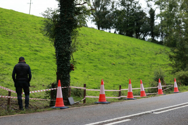 a-person-pays-their-respects-at-the-scene-on-the-n54-clones-to-smithborough-road-at-legnakelly-co-monaghan-after-two-teenage-pupils-from-largy-college-in-clones-were-killed-and-three-people-are-in