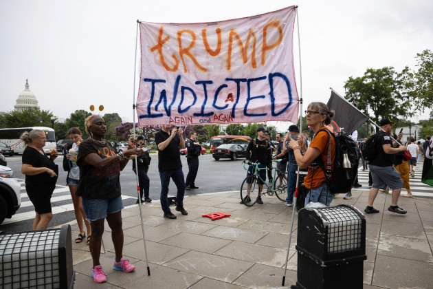 people-react-outside-the-e-barrett-prettyman-u-s-courthouse-in-washington-d-c-on-aug-3-2023-after-former-president-donald-trump-was-arraigned-on-federal-charges-relating-to-efforts-to-overturn-t