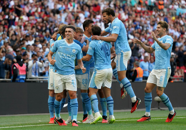 manchester-citys-cole-palmer-centre-of-huddle-celebrates-with-team-mates-after-scoring-their-sides-first-goal-of-the-game-during-the-fa-community-shield-match-at-wembley-stadium-london-picture-d