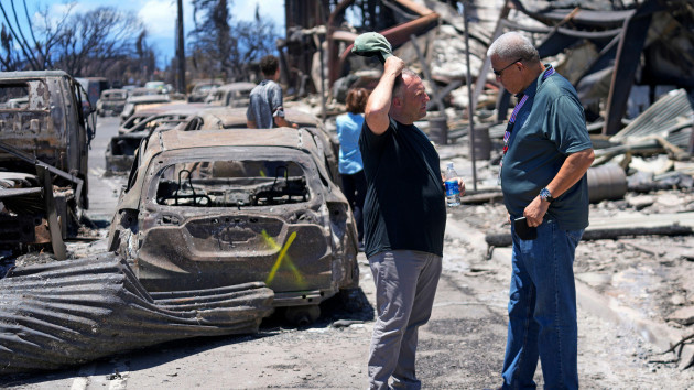 governor-of-hawaii-josh-green-left-and-maui-county-mayor-richard-bissen-jr-speak-during-a-tour-of-wildfire-damage-on-saturday-aug-12-2023-in-lahaina-hawaii-ap-photorick-bowmer