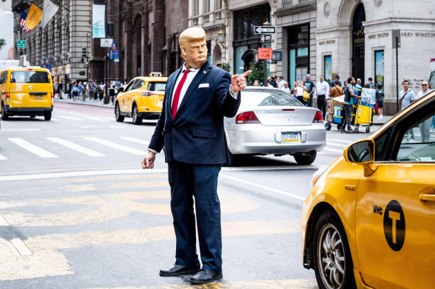 august-3-2023-new-york-city-new-york-usa-a-donald-trump-impersonator-gestures-near-a-protest-outside-trump-tower-in-new-york-city-former-president-trump-pleaded-not-guilty-to-trying-to-overturn