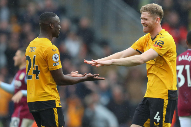 toti-gomes-24-of-wolverhampton-wanderers-and-nathan-collins-4-of-wolverhampton-wanderers-celebrate-their-teams-win-after-the-premier-league-match-wolverhampton-wanderers-vs-aston-villa-at-molineux