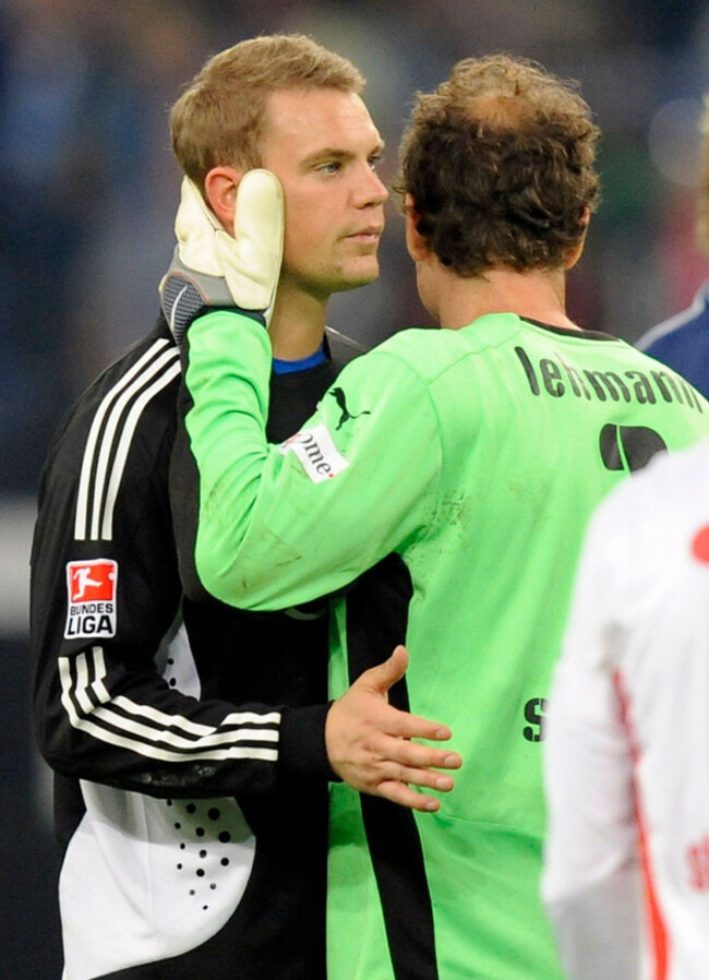 stuttgarts-goalkeeper-jens-lehmann-right-comforts-schalkes-goalkeeper-manuel-neuer-after-the-german-first-division-bundesliga-soccer-match-between-fc-schalke-04-and-vfb-stuttgart-in-gelsenkirchen