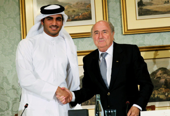 file-in-this-saturday-nov-9-2013-file-photo-fifa-president-sepp-blatter-right-shakes-hands-with-sheik-mohammed-bin-hamad-al-thani-chairman-of-qatar-2022-bid-committee-at-a-press-conference