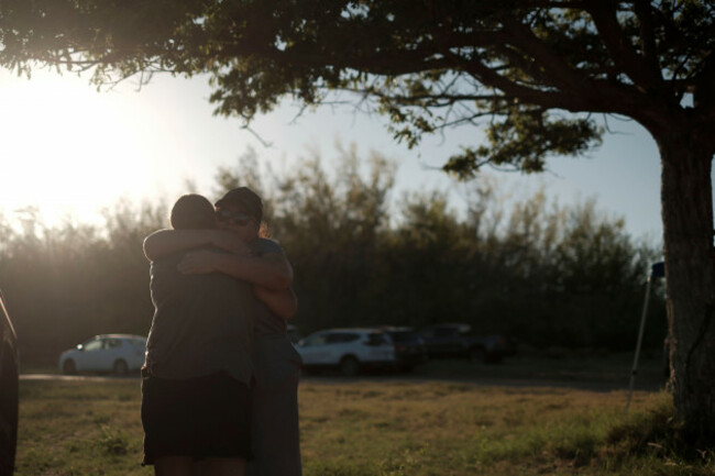 a-woman-embraces-with-her-friend-just-after-confirming-their-safeties-on-the-island-of-maui-in-state-of-hawaii-united-states-on-august-19-2023-the-yomiuri-shimbun-via-ap-images