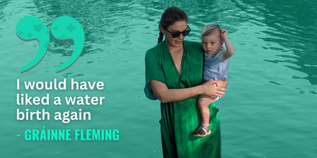Gráinne Fleming wearing a green dress holding her son beside a lake with quote - I would have liked a water birth again.