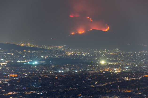 on-22082023-a-wildfire-started-on-the-foothills-of-mountain-parnitha-in-the-western-suburbs-of-athens-greece-fueled-by-strong-winds-it-quickly-grew-and-burned-houses-and-businesses-this-photo-is