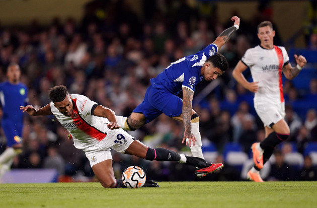 chelseas-enzo-fernandez-and-luton-towns-jacob-brown-left-battle-for-the-ball-during-the-premier-league-match-at-stamford-bridge-london-picture-date-friday-august-25-2023