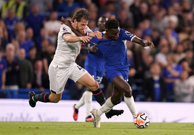 chelseas-nicolas-jackson-and-luton-towns-tom-lockyer-left-battle-for-the-ball-during-the-premier-league-match-at-stamford-bridge-london-picture-date-friday-august-25-2023