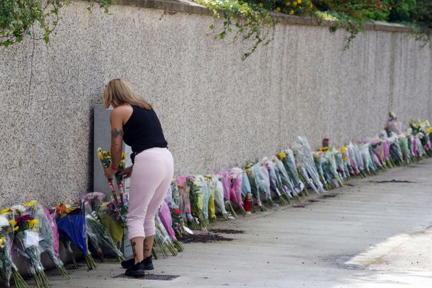 flowers-and-tributes-left-near-to-the-scene-in-clonmel-co-tipperary-where-four-young-people-died-in-a-car-crash-while-on-the-way-to-exam-results-celebrations-luke-mcsweeney-his-sister-grace-mcswee