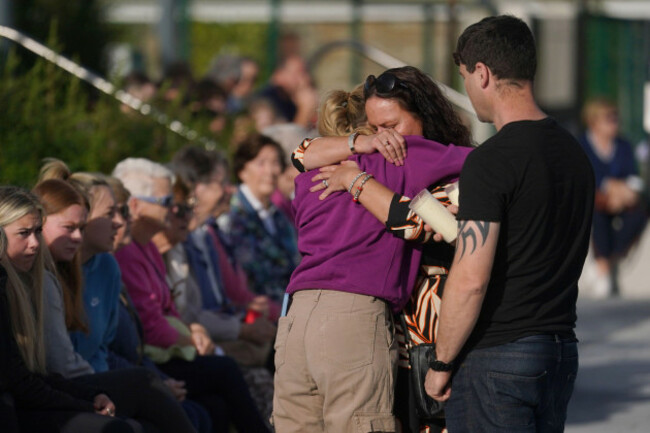 people-comfort-each-other-ahead-of-a-vigil-in-kickham-plaza-co-tipperary-in-memory-of-luke-mcsweeney-24-his-18-year-old-sister-grace-mcsweeney-zoey-coffey-and-nicole-murphy-both-also-18-who-die