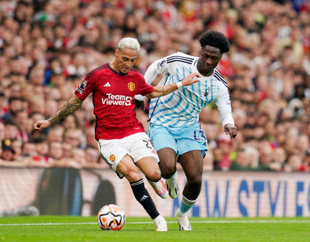 manchester-uk-26th-aug-2023-antony-of-manchester-united-tussles-with-ola-aina-of-nottingham-forest-during-the-premier-league-match-at-old-trafford-manchester-picture-credit-should-read-andrew-y