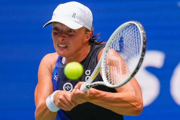 iga-swiatek-of-poland-returns-a-shot-to-rebecca-peterson-of-sweden-during-the-first-round-of-the-u-s-open-tennis-championships-monday-aug-28-2023-in-new-york-ap-photomanu-fernandez