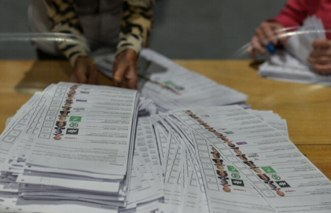 election-staff-wearing-face-masks-and-working-behind-protective-screens-count-ballots-during-the-dublin-bay-south-by-election-in-simmonscourt-rds-in-ballsbridge-dublin-on-friday-09-july-2021-in