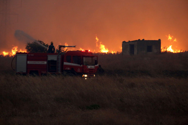 a-firefighter-operates-during-a-wildfire-near-the-northeastern-town-of-alexandroupolis-greece-sunday-aug-20-2023-greek-authorities-on-saturday-evacuated-eight-villages-near-the-northeastern-bord