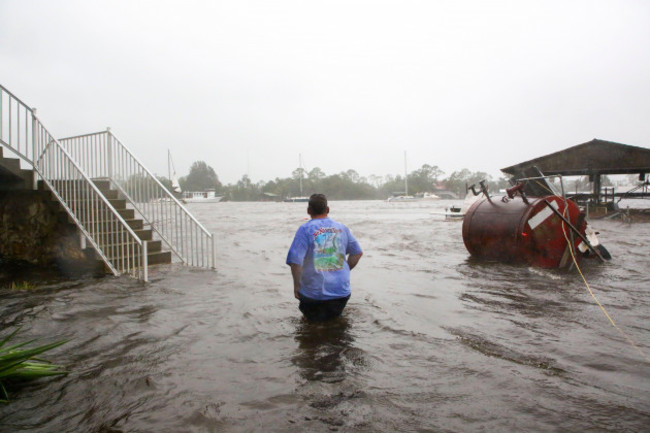 steinhatchee-florida-usa-30th-aug-2023-daniel-dickert-wades-into-the-steinhatchee-river-which-remained-out-of-its-banks-on-wednesday-aug-30-2023-where-storm-surge-from-hurricane-idalia-swelled