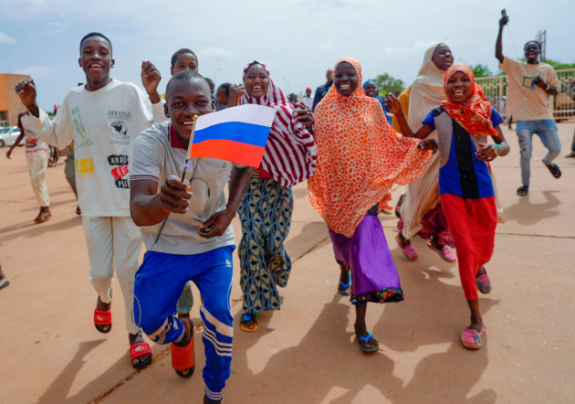 supporters-of-nigers-ruling-junta-hold-a-russian-flag-in-niamey-niger-sunday-aug-6-2023-nigeriens-are-bracing-for-a-possible-military-intervention-as-times-run-out-for-its-new-junta-leaders-to