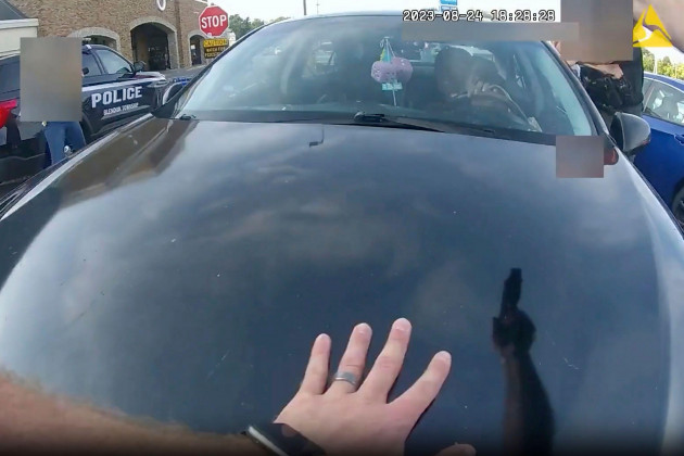 this-still-image-from-bodycam-video-released-by-the-blendon-township-police-on-friday-sept-1-2023-shows-an-officer-pointing-his-gun-at-takiya-young-moments-before-shooting-her-through-the-windshi