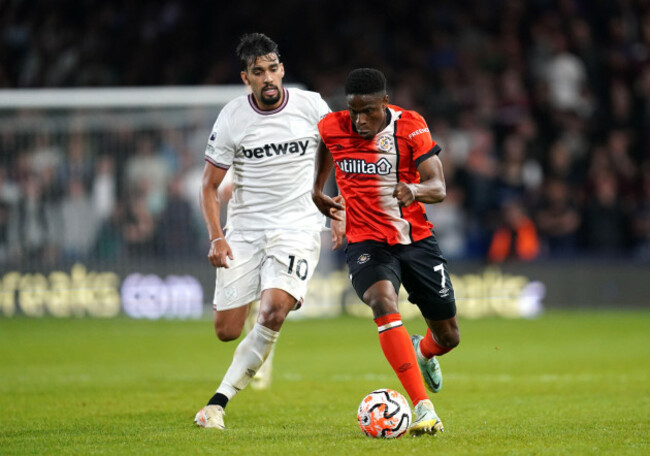 west-ham-uniteds-lucas-paqueta-left-and-luton-towns-chiedozie-ogbene-battle-for-the-ball-during-the-premier-league-match-at-kenilworth-road-luton-picture-date-friday-september-1-2023