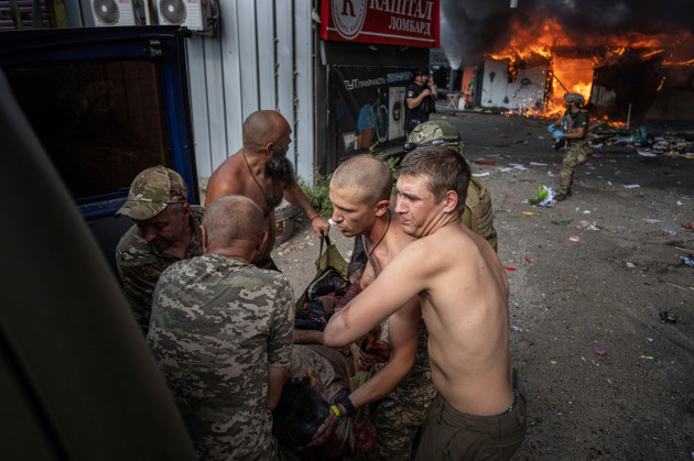 ukrainian-soldiers-move-to-the-ambulance-an-injured-woman-after-a-russian-rocket-attack-on-a-food-market-in-the-city-center-of-kostiantynivka-ukraine-wednesday-sept-6-2023-ap-photoevgeniy-malo