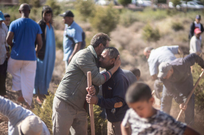 people-comfort-each-other-while-digging-graves-for-victims-of-the-earthquake-in-ouargane-village-near-marrakech-morocco-saturday-sept-9-2023-a-rare-powerful-earthquake-struck-morocco-sending