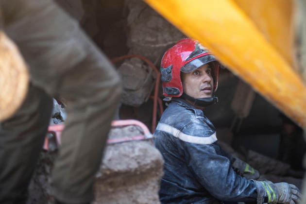 corrects-name-of-village-a-rescue-workers-pauses-while-taking-part-in-a-rescue-operation-after-the-earthquake-in-moulay-brahim-village-near-marrakech-morocco-saturday-sept-9-2023-a-rare-power