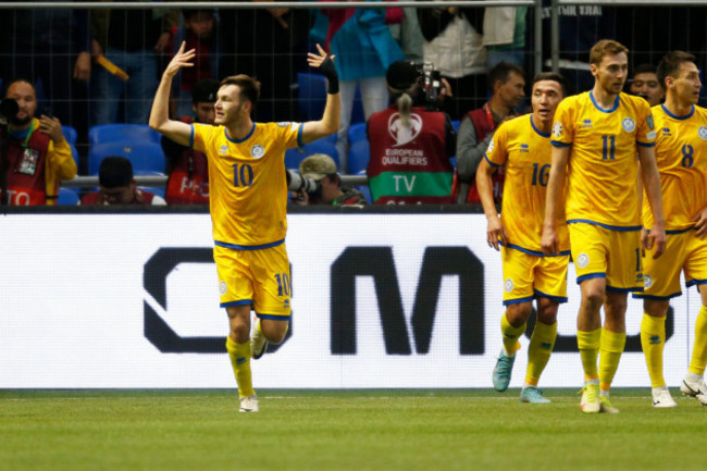 kazakhstans-maxim-samorodov-left-celebrates-after-scoring-his-sides-first-goal-during-the-euro-2024-group-h-qualifying-soccer-match-between-kazakhstan-and-northern-ireland-at-the-astana-arena-in-a