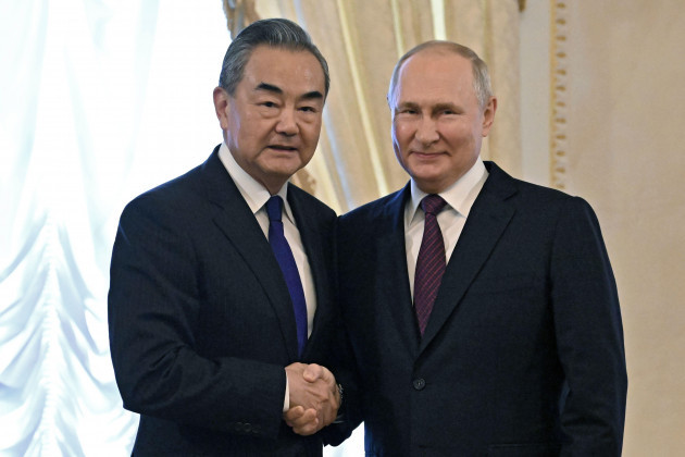 russian-president-vladimir-putin-right-and-chinese-foreign-minister-wang-yi-shake-hands-before-a-meeting-at-the-constantine-palace-in-st-petersburg-russia-wednesday-sept-20-2023-kristina-kor
