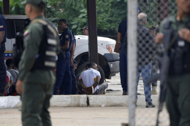 inmates-sit-with-their-hands-behind-their-backs-during-a-raid-of-the-tocoron-penitentiary-center-in-tocoron-venezuela-wednesday-sept-20-2023-soldiers-carried-out-the-prison-raid-in-an-effort-to