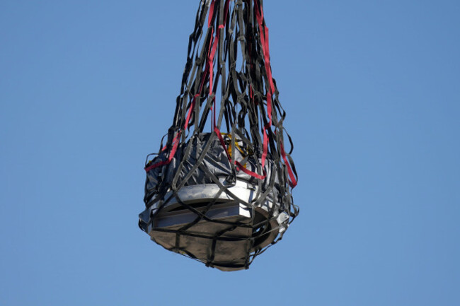 a-helicopter-delivers-a-space-capsule-carrying-nasas-first-asteroid-samples-on-sunday-sept-24-2023-to-a-temporary-clean-room-at-dugway-proving-ground-in-utah-the-osiris-rex-spacecraft-released