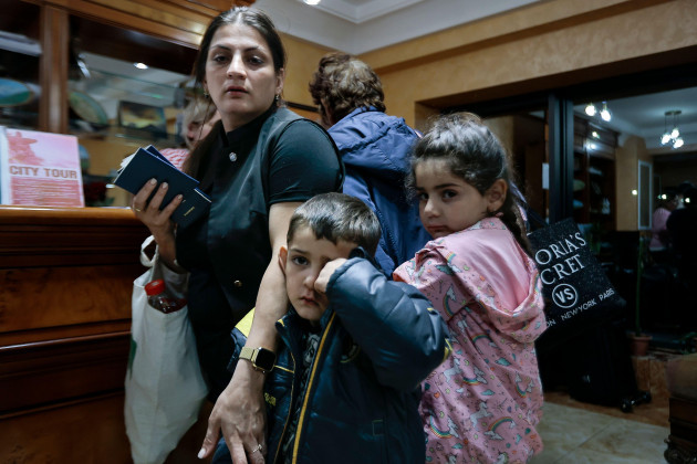ethnic-armenians-from-the-first-group-of-about-30-people-from-nagorno-karabakh-to-armenia-lineup-waiting-to-be-temporarily-checked-into-a-hotel-in-goris-the-town-in-syunik-region-armenia-sunday-se