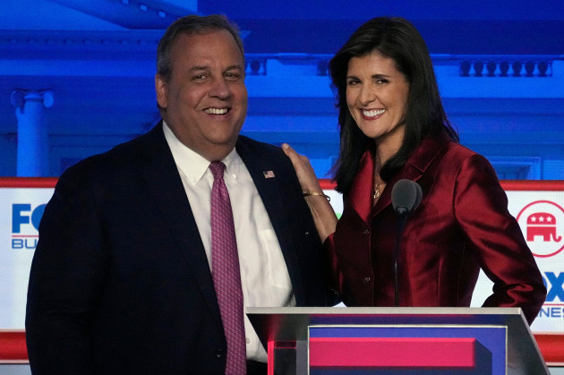former-new-jersey-gov-chris-christie-left-smiles-next-to-former-u-n-ambassador-nikki-haley-during-a-break-in-a-republican-presidential-primary-debate-hosted-by-fox-business-network-and-univision