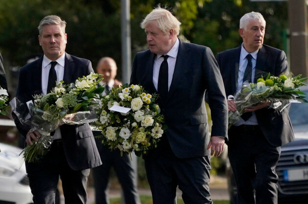 british-prime-minister-boris-johnson-leader-of-the-labour-party-sir-keir-starmer-left-followed-by-speaker-of-the-house-of-commons-lindsay-lindsey-hoyle-carry-flowers-as-they-arrive-at-the-scene-wh