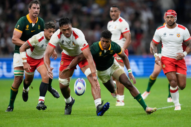 tongas-sam-lousi-left-challenges-for-the-ball-with-south-africas-canan-moodie-during-the-rugby-world-cup-pool-b-match-between-south-africa-and-tonga-at-marseilles-stade-velodrome-france-sunday