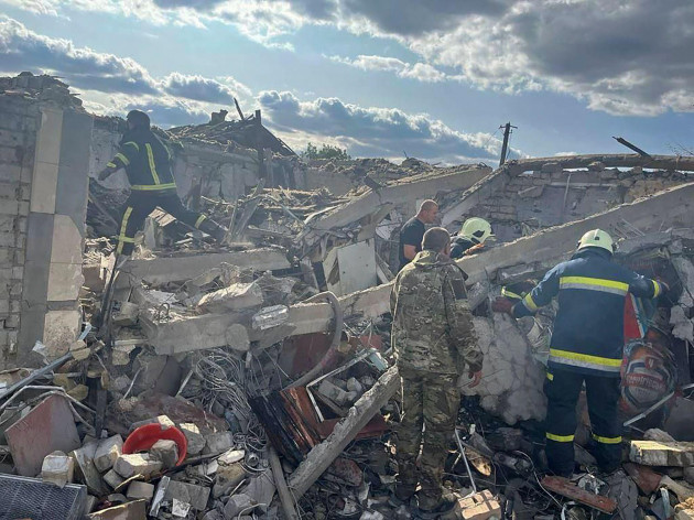 in-this-photo-provided-by-the-ukrainian-presidential-press-office-emergency-workers-search-the-victims-of-a-russian-rocket-attack-that-killed-at-least-47-people-in-the-village-of-hroza-near-kharkiv