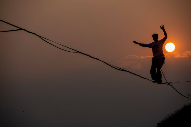 highline-festival-in-bandung-participants-walk-on-a-tightrope-during-the-highline-festival-in-bandung-west-java-indonesia-october-14-2023-the-festival-was-held-to-build-awareness-to-protect-the-en