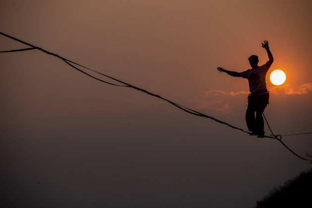 highline-festival-in-bandung-participants-walk-on-a-tightrope-during-the-highline-festival-in-bandung-west-java-indonesia-october-14-2023-the-festival-was-held-to-build-awareness-to-protect-the-en