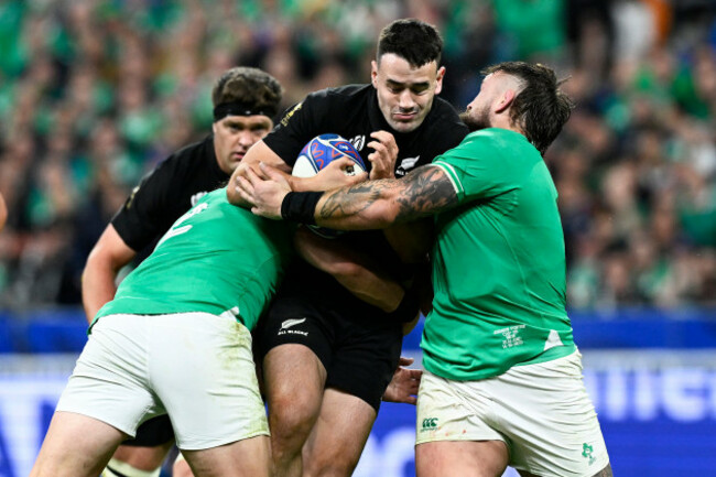 will-jordan-is-tackled-by-andrew-porter-and-dan-sheehan