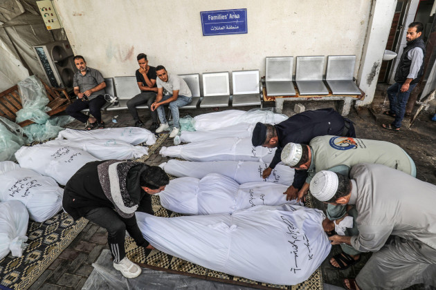 rafah-palestinian-territories-16th-oct-2023-people-gather-in-the-courtyard-of-a-morgue-at-al-najjar-hospital-in-rafah-by-the-wrapped-bodies-of-palestinians-killed-in-an-israeli-airstrike-on-khan-y