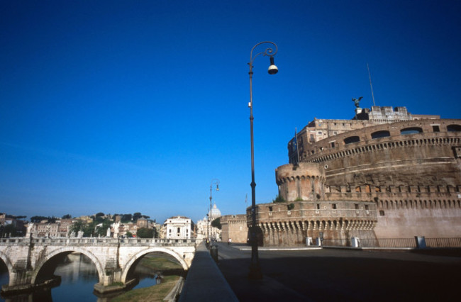 view-of-the-castle-and-the-bridge-of-sant-angelo-near-the-tiber-river-and-the-vatican-city-in-the-background