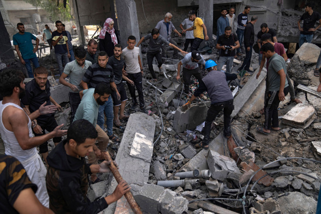 palestinians-look-for-survivors-in-a-building-destroyed-in-israeli-bombardment-in-rafah-refugee-camp-in-gaza-strip-on-tuesday-oct-17-2023-ap-photofatima-shbair