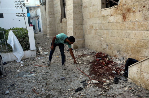 a-palestinian-man-inspects-the-damage-at-al-ahli-hospital-in-gaza-city-wednesday-oct-18-2023-the-hamas-run-health-ministry-says-an-israeli-airstrike-caused-the-explosion-that-killed-hundreds-at