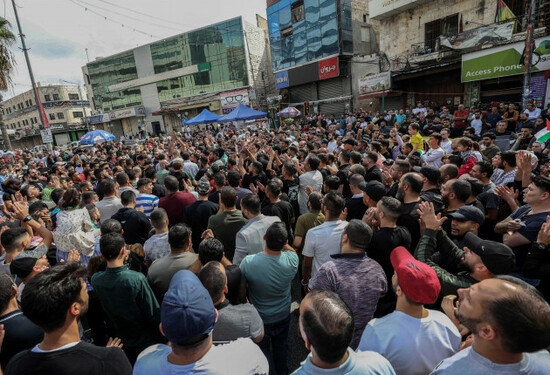 nablus-palestinian-territories-18th-oct-2023-palestinian-demonstrators-gesture-and-chant-slogans-during-a-demonstration-against-israel-in-the-west-bank-city-of-nablus-following-a-devastating-expl