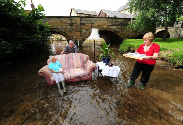 residents-of-pickering-in-north-yorkshire-moved-living-room-furniture-into-the-river-which-runs-through-the-town-today-to-recreate-the-scenes-they-faced-in-the-devastating-floods-of-last-year-91-year