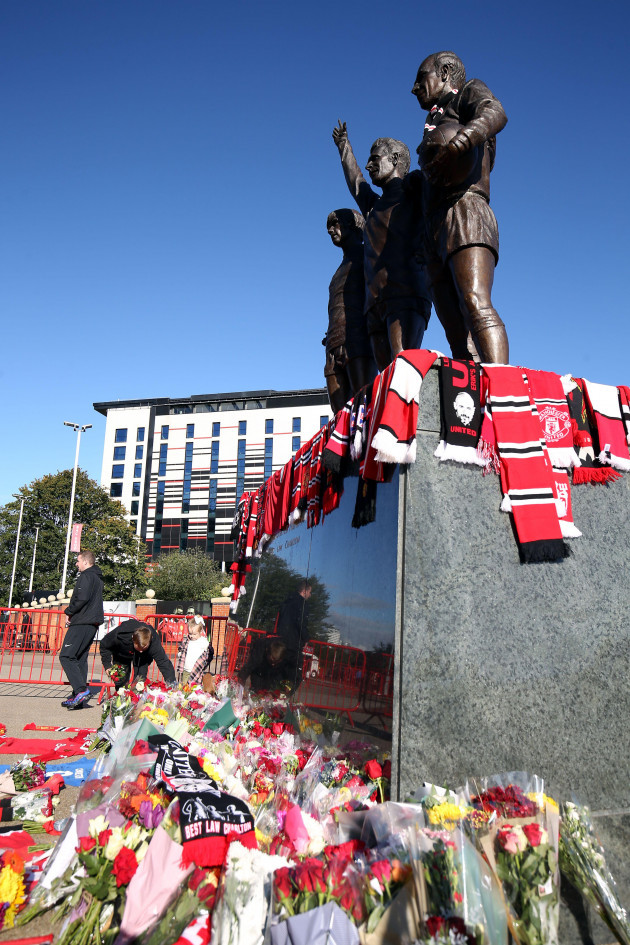tributes-are-laid-in-memory-of-sir-bobby-charlton-by-the-united-trinity-statue-at-old-trafford-manchester-sir-bobby-charlton-has-died-aged-86-his-family-announced-yesterday-picture-date-sunday-oc
