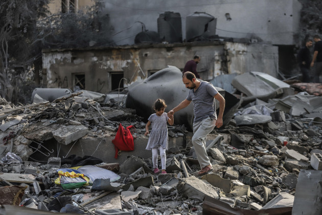 gaza-city-palestinian-territories-23rd-oct-2023-a-palestinian-and-a-child-inspect-the-destruction-caused-by-an-israeli-strike-credit-mohammad-abu-elsebahdpaalamy-live-news